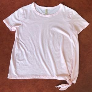 light pink short sleeve with knot in bottom corner